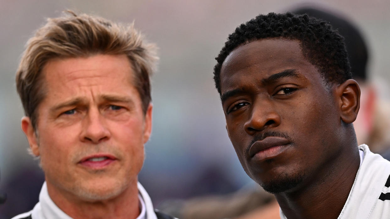  JULY 09: Brad Pitt, star of the upcoming Formula One based movie, Apex, and Damson Idris, co-star of the upcoming Formula One based movie, Apex, look on from the grid during the F1 Grand Prix of Great Britain at Silverstone Circuit on July 09, 2023 in Northampton, England. 