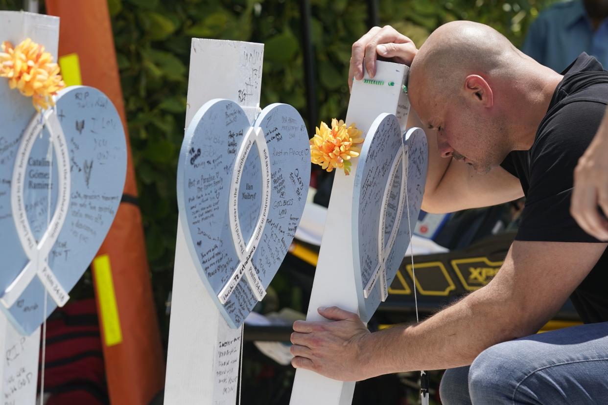 Lazaro Carnero mourns for his best friend Edgar Gonzalez, during a remembrance event Friday in Surfside, Fla. 