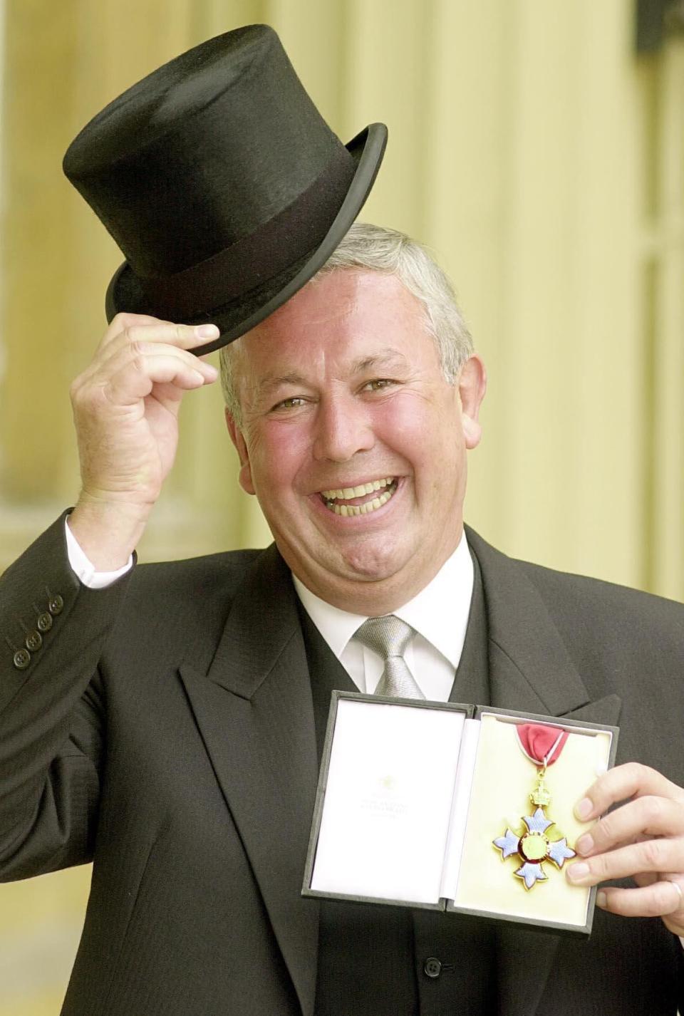 At Buckingham Palace in 2000 following his appointment as CBE - PA/Alamy