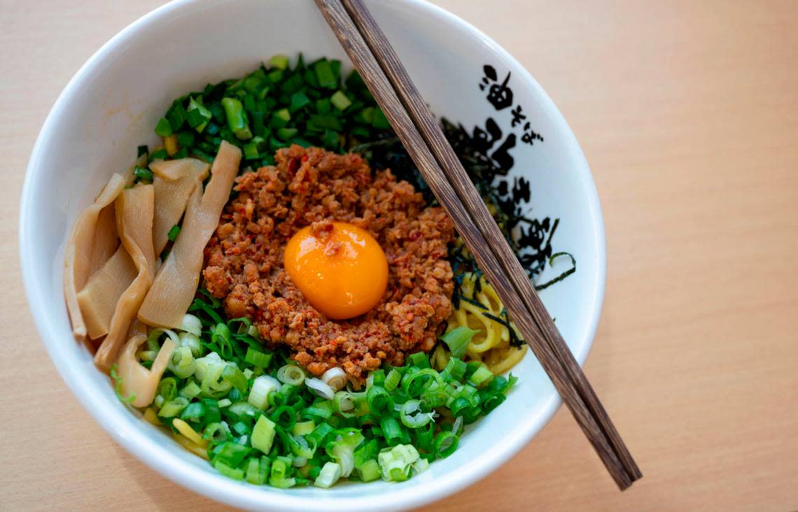 Kajiken’s signature dish is homura abura soba, which has spicy minced pork, green onions, bamboo shoots, seaweed, fish powder, chives and raw egg yolk.