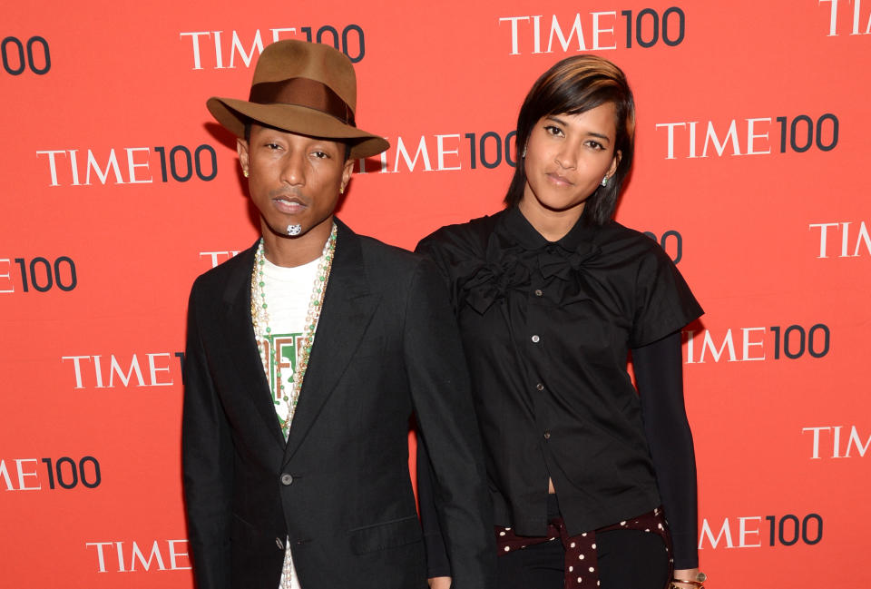 Pharrell Williams, left, and Helen Lasichanh arrive at 2014 TIME 100 Gala held at Frederick P. Rose Hall, Jazz at Lincoln Center, on Tuesday, April 29, 2014, in New York. (Photo by Evan Agostini/Invision/AP)