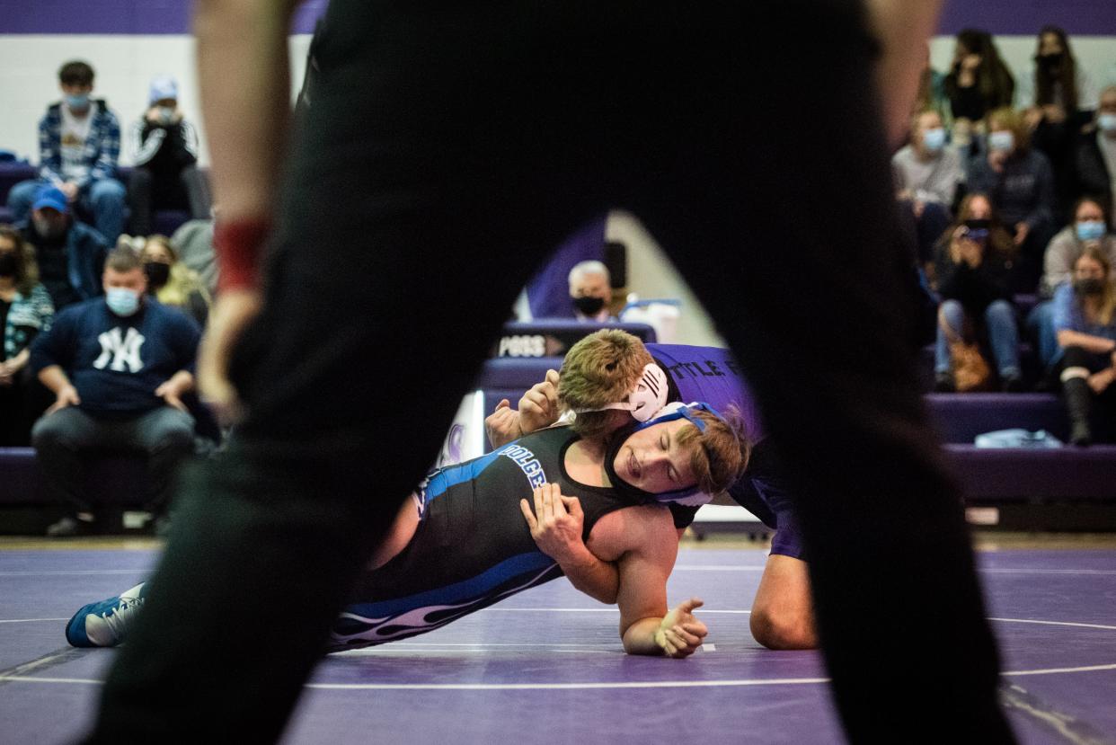 Little Falls' Connor Baylor wrestles Dolgeville's Gabe Herringshaw in the 160 pound match on Thursday, Dec. 9, 2021 at Little Falls High School. Little Falls won 42-36.