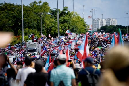 Demonstrators attend the national strike calling for the resignation of Governor Ricardo Rossello, in San Juan