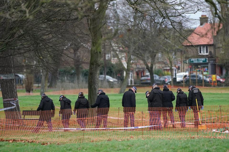 Officers close to the scene of the murder in Croydon (PA Wire)