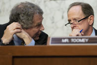 Senate Banking Committee Chairman Sen. Sherrod Brown, D-Ohio, left, speaks with ranking member Sen. Pat Toomey, R-Pa., during an annual Wall Street oversight hearing, Thursday, Sept. 22, 2022, on Capitol Hill in Washington. (AP Photo/Jacquelyn Martin)