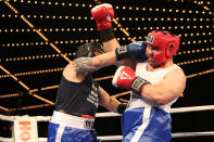 <p>New York’s Finest Dom Nasso, left, and Elwin Martinez mix it up in the ring during the NYPD Boxing Championships at the Theater at Madison Square Garden on June 8, 2017. (Photo: Gordon Donovan/Yahoo News) </p>