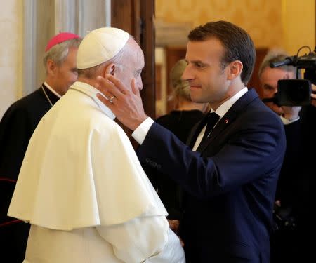 Pope Francis meets French President Emmanuel Macron during a private audience at the Vatican, June 26, 2018. Alessandra Tarantino/ Pool via Reuters