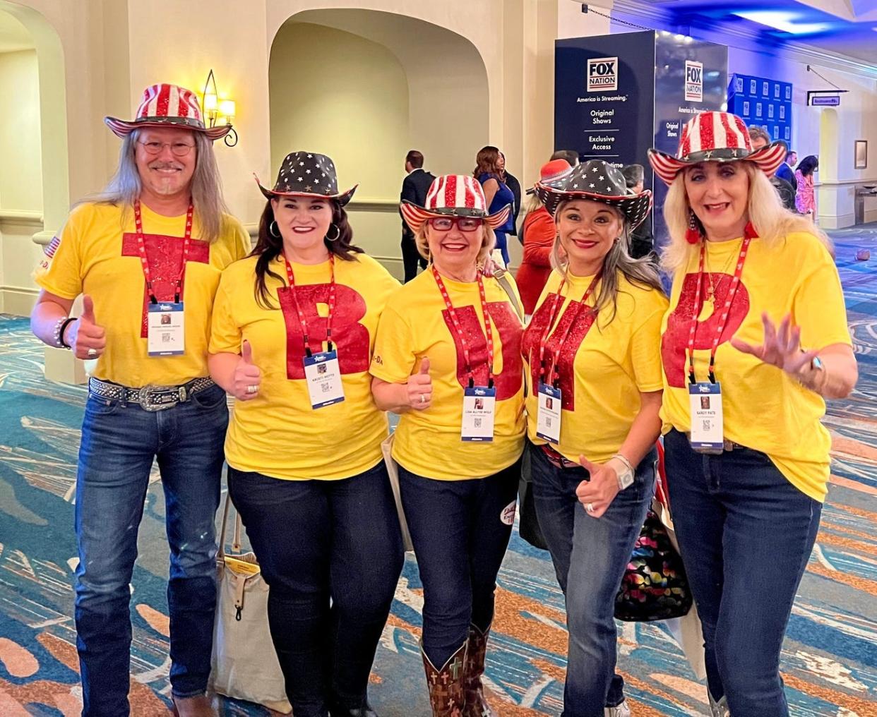 A group of Donald Trump fans show their support while attending the Conservative Political Action Conference, in Orlando, last week.