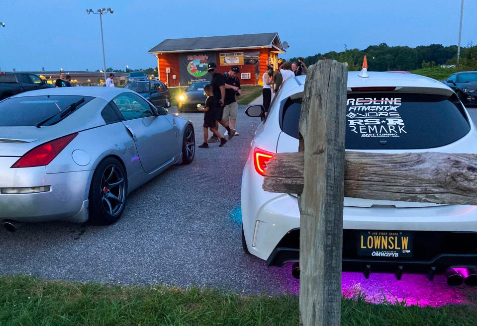 Car enthusiasts hang out at an informal gathering at Pit Daddy's BBQ outside Smyrna earlier this month.