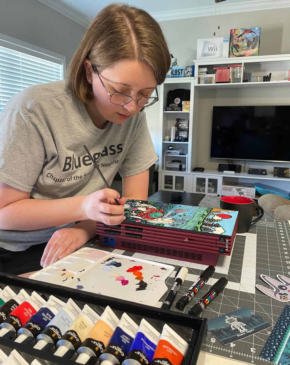 Though Adam Foshie is the electrical engineer, Samantha Malone likes to use her artistic skills with them. “Video games were such an integral part of our generation’s history,” she said. “It’s super awesome to be able to bring them back to play on a TV today." April 2024