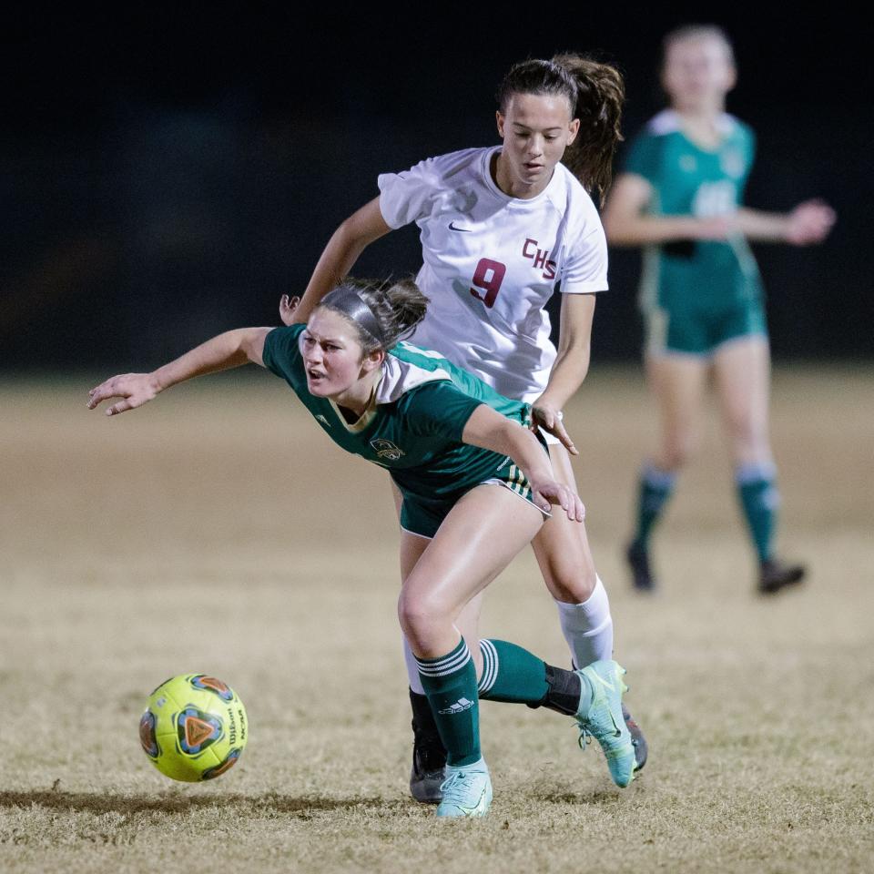 Chiles' Layla Thompson (9) knocks down a Lincoln player. The Chiles Timberwolves defeated the Lincoln Trojans 2-0 Tuesday, Nov. 30, 2021.