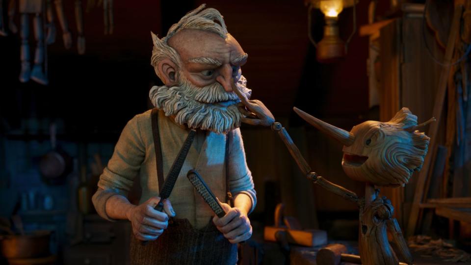 Gepetto (voiced by David Bradley) and Pinocchio (Gregory Mann) in 