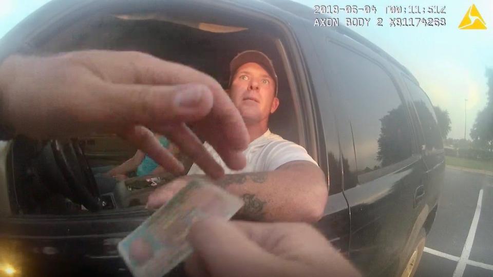 Prosecutors allege former Jackson County Deputy Zach Wester framed more than a dozen people for drug possession during bogus traffic tops. This image was taken from Wester's body camera of his June 2018 arrest of Chris Fears, who was later cleared.