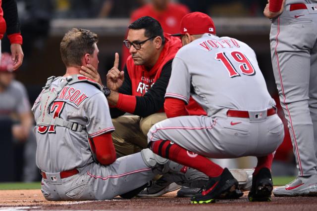 Apr 19, 2022; San Diego, California, USA; A Cincinnati Reds trainer checks on catcher Tyler Stephenson (37) after a collision at home plate with San Diego Padres designated hitter Luke Voit (not pictured) during the first inning at Petco Park.