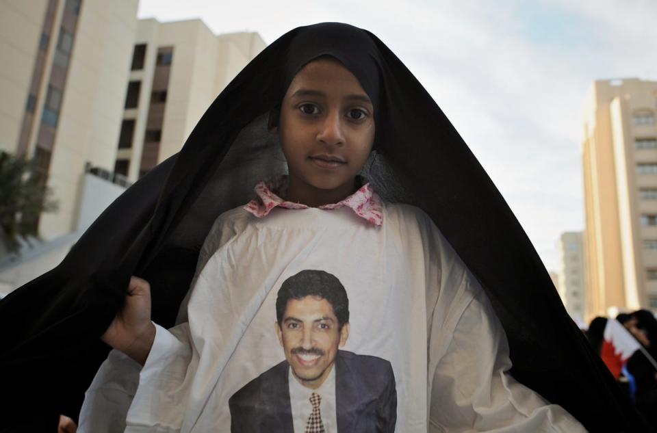 Bahraini girl wears top with image of Abdulhadi al-Khawaja, prominent Bahraini human rights activist currently serving life sentence (AFP via Getty Images)