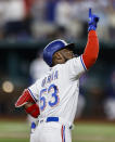 Texas Rangers' Adolis Garcia (53) celebrates hitting a solo home run during the sixth inning of a baseball game against the Oakland Athletics, Wednesday, June 23, 2021, in Arlington, Texas. (AP Photo/Brandon Wade)