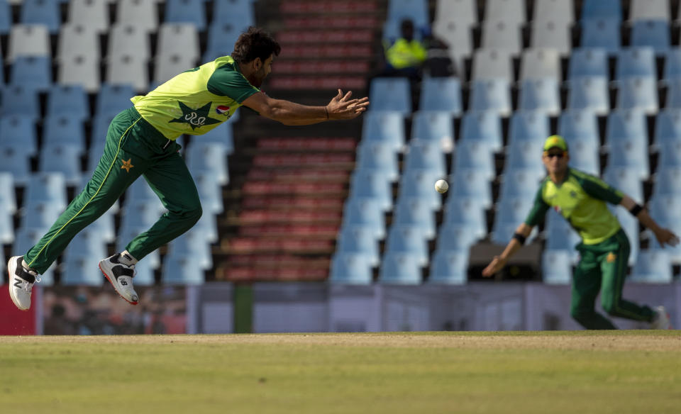 Pakistan's bowler Haris Rauf attempts fielding his own bowling during the fourth and final T20 cricket match between South Africa and Pakistan at Centurion Park in Pretoria, South Africa, Friday, April 16, 2021. (AP Photo/Themba Hadebe)