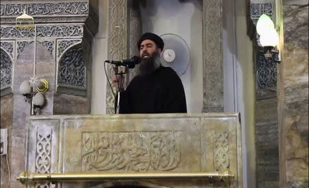 A man purported to be the reclusive leader of the militant Islamic State Abu Bakr al-Baghdadi has made what would be his first public appearance at a mosque in the centre of Iraq's second city, Mosul, according to a video recording posted on the Internet on July 5, 2014, in this still image taken from video. REUTERS/Social Media Website via Reuters TV/Files