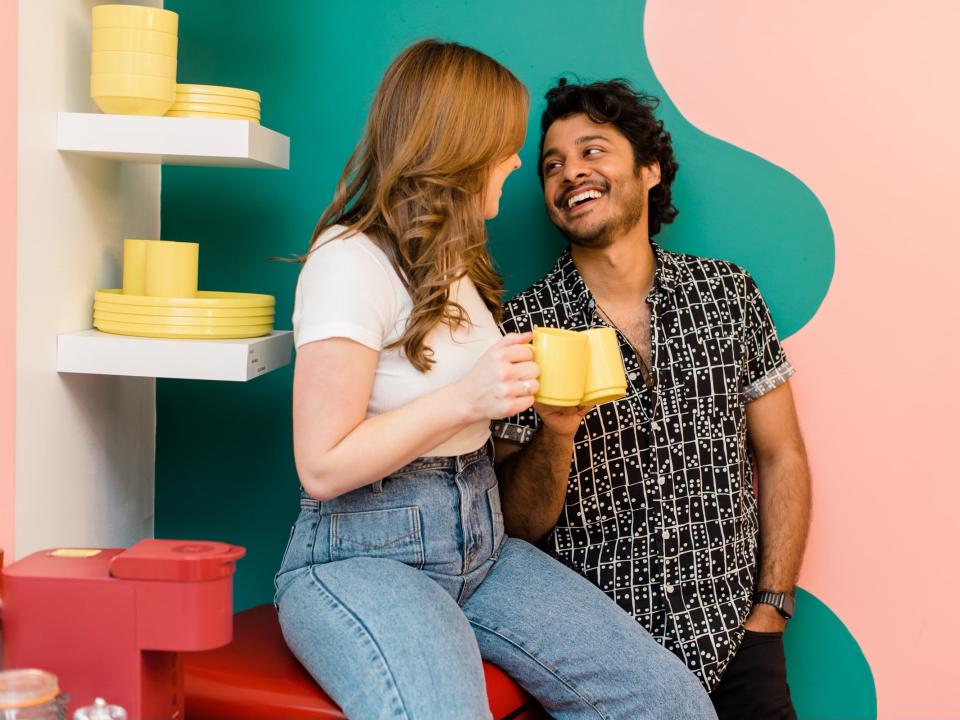 The author and her partner, looking at each other and smiling