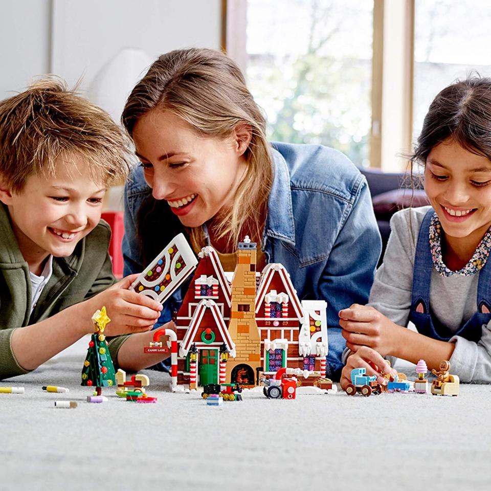 <a href="https://amzn.to/3cuRqEx" target="_blank" rel="noopener noreferrer">Build a gingerbread house</a> &mdash; without getting frosting all over the kitchen. This Lego kit lets little ones create a house with frosted roofs and candy cane columns. It comes with a toy train and candy furniture as well. And bonus: It doubles as holiday decor. <a href="https://amzn.to/3cuRqEx" target="_blank" rel="noopener noreferrer">Find it for $100 at Amazon</a>.