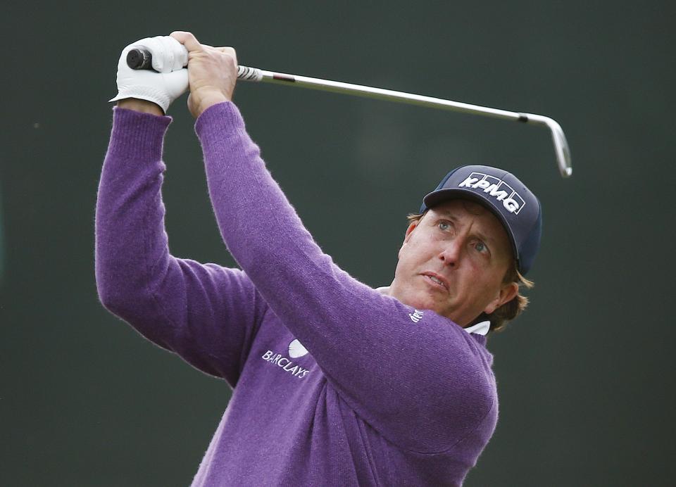 Phil Mickelson hits his tee shot at the 16th hole during the second round of the Phoenix Open golf tournament Friday, Jan. 31, 2014, in Scottsdale, Ariz. (AP Photo/Ross D. Franklin)