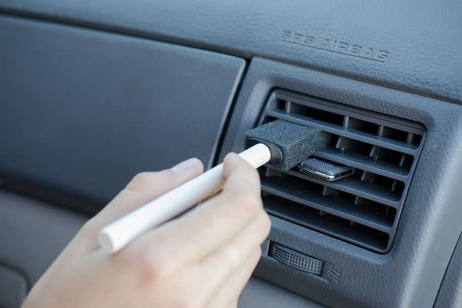 Dust car vents with a sponge paint brush.