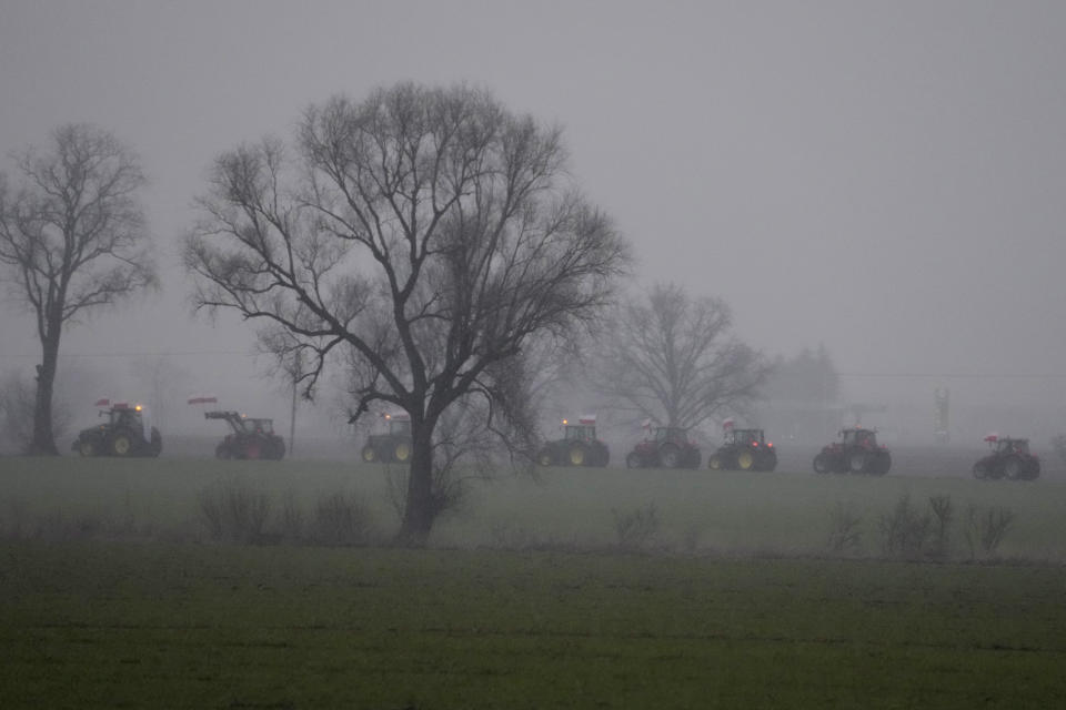 Poland's farmers driving their heavy-duty tractors down roads in western Poland as part of a nationwide farmer protest against European Union's agrarian policy and imports of cheap Ukraine produce, which, they say, are undercutting their livelihoods, near Poznan, Poland, Friday Feb. 9, 2024. (AP Photo/Czarek Sokolowski)