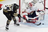 Boston Bruins' David Pastrnak (88) takes a shot on Florida Panthers' Sergei Bobrovsky (72) during the second period of an NHL hockey game, Saturday, April 6, 2024, in Boston. (AP Photo/Michael Dwyer)