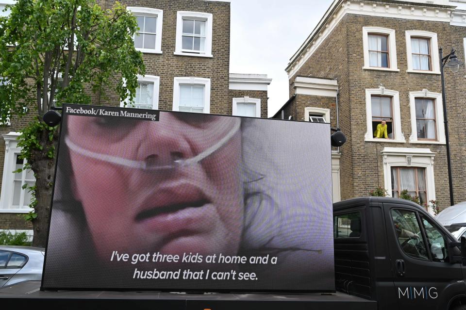 A big screen organised by British political campaign group Led By Donkeys mounted on a vehicle plays a video clip outside the home of Number 10 Downing Street special advisor Dominic Cummings in London on May 24, 2020 following allegations Cummings broke coronavirus lockdown rules by travelling across the country in March. - British Prime Minister Boris Johnson was under increased pressure on Sunday to sack top aide Dominic Cummings who was facing allegations that he had breached coronavirus lockdown rules for a second time. The British government has so far rejected calls to sack Cummings over allegations he broke coronavirus lockdown rules by travelling across the country with his wife while she was suffering from symptoms of the disease, but even MPs from his own party were calling for him to leave on Sunday. (Photo by Glyn KIRK / AFP) (Photo by GLYN KIRK/AFP via Getty Images)