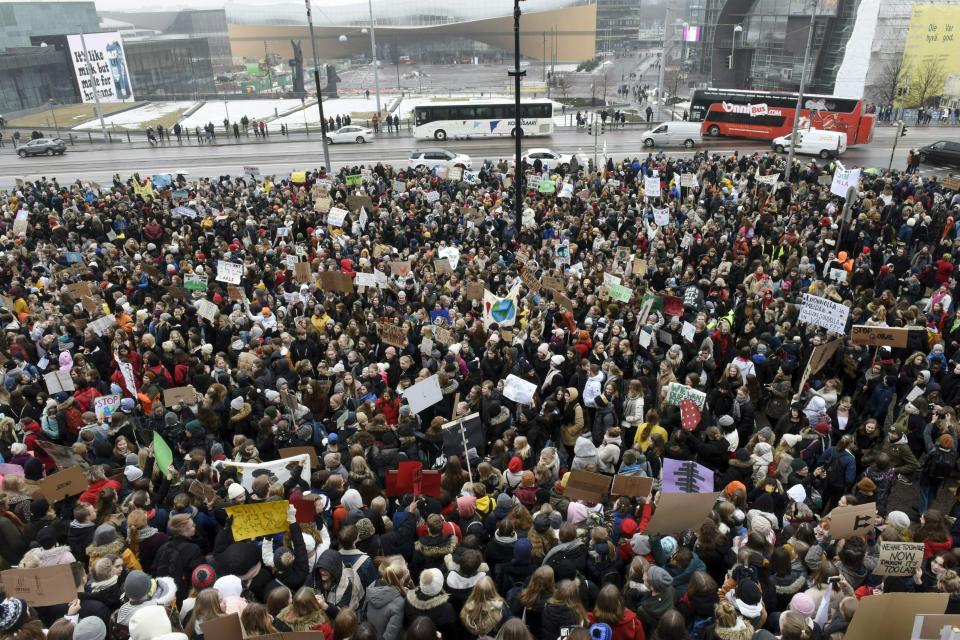 Young demonstrators gather at the Finnish Parliament during a protest march of Finnish youth calling for climate protection, in Helsinki, Finland, Friday, March 15, 2019. Students in cities worldwide skipped classes Friday in protest over their governments' failure to act against global warming. (Heikki Saukkomaa/Lehtikuva via AP)