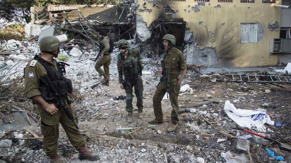 Israeli soldiers inspect houses that were destroyed in a battle between Israeli soldiers and Palestinian militants on Oct. 7. (Photo by Amir Levy/Getty Images) - Amir Levy/Getty Images