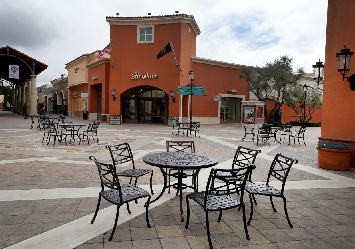 Empty chairs ring a plaza at the Simi Valley Town Center on Friday. Developers are considering adding residential units to the shopping mall, which has struggled at times since opening in 2005.