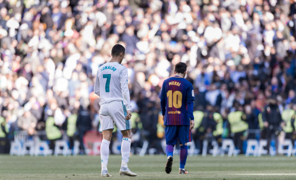 Ronaldo and Messi walk off the pitch during a La Liga match between Real Madrid and Barcelona at Santiago Bernabéu Stadium in Madrid, Spain, on Dec. 23, 2017.<span class="copyright">Power Sport Images/Getty Images</span>