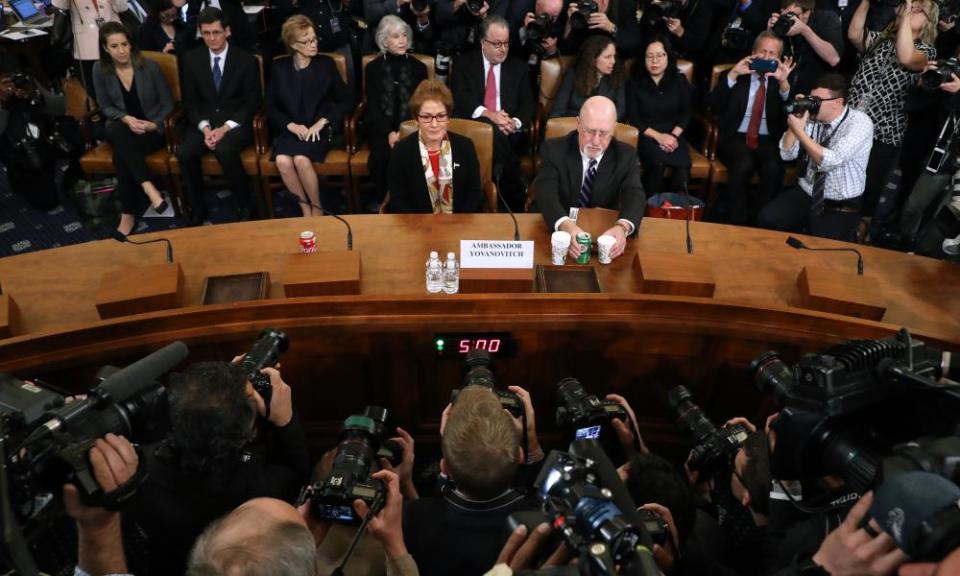 Marie Yovanovitch, right, sits next to her attorney, Larry Robbins, before testifying on Capitol Hill in Washington DC, on 15 November.