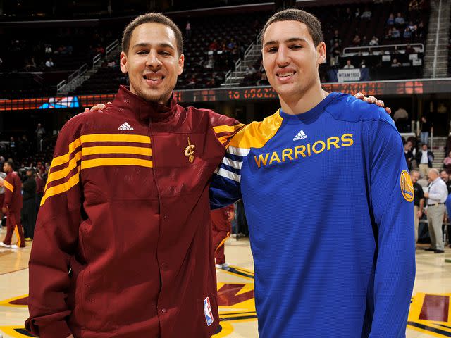 <p>David Liam Kyle/NBAE/Getty </p> Mychel Thompson #21 of the Cleveland Cavaliers stands alongside his brother Klay Thompson #11 of the Golden State Warriors at The Quicken Loans Arena on January 17, 2012 in Cleveland, Ohio.