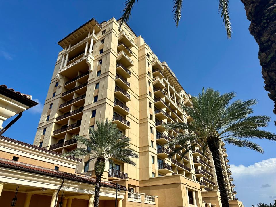 Four Seasons Orlando yellow hotel with balconies throughout