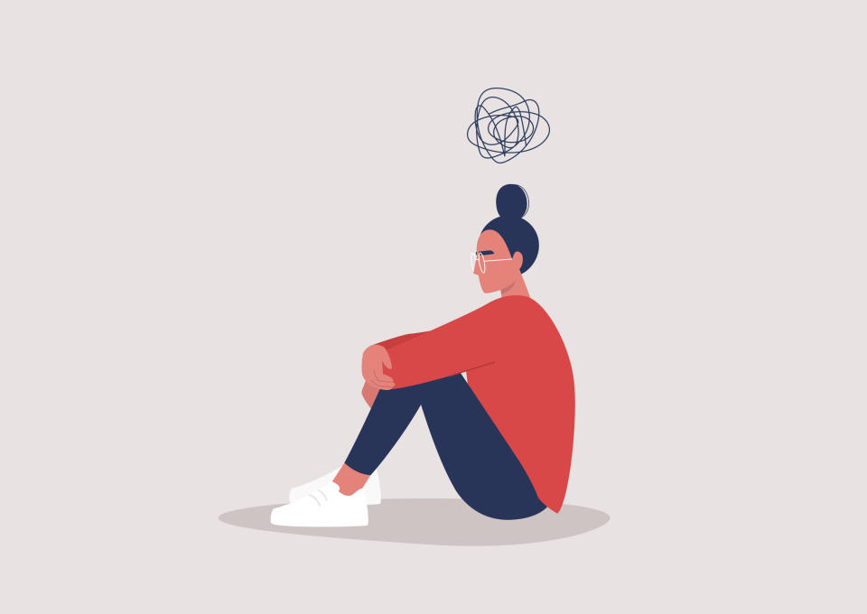 illustrated image of a woman hugging her knees with a swirl above her head depicting her mental health