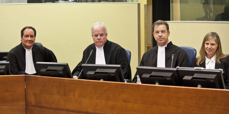 <span class="caption">The Prosecution team in the case of Ratko Mladić, former commander of the Bosnian Serb Army, at Mladić’s initial appearance.</span> <span class="attribution"><a class="link " href="https://www.flickr.com/photos/icty/38362818296/in/photolist-9Mgq4q-oMbmvS-bv3iqL-9MHbyF-GQnVnF-9SqZ6C-GQnVvB-Dpbets-21rZs4G-ZqwwKn-QmyYtM-9Qf31o-GQnV18-GQnVEp-21rZtkE-ZqwwVT-GQnWgz-GQnVNR-GQnVdT-GQnWpF-Dpbex5-ZqNupP-Dpbefm-57FJbJ-7uTBvq-21Nzjq2" rel="nofollow noopener" target="_blank" data-ylk="slk:UN International Criminal Tribunal for the former Yugoslavia.;elm:context_link;itc:0;sec:content-canvas">UN International Criminal Tribunal for the former Yugoslavia.</a></span>