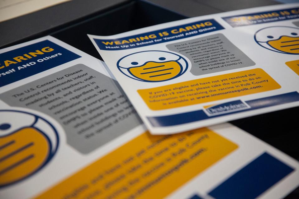 Copies of posters encouraging mask wearing, shown on Monday, Aug. 9, 2021, are being made to hang in Des Moines Public School buildings when the new school year begins.