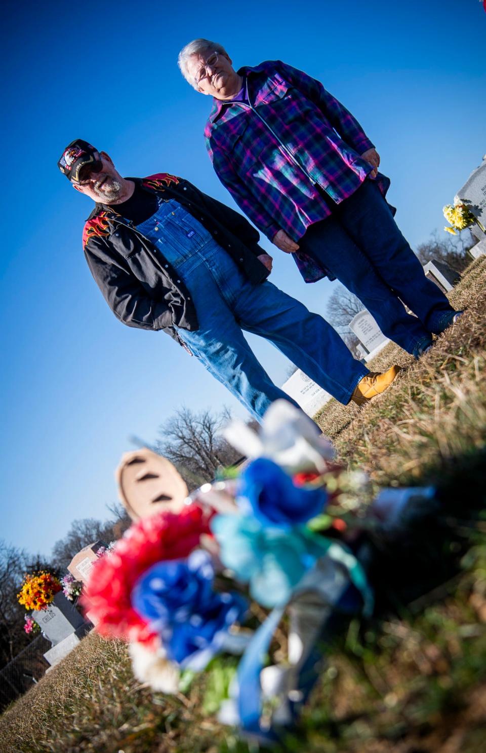 Jim and Joan Thompson stand at the gravesite for John Thompson, Jim's brother, at the Solsberry Cemetery on Friday, Feb. 23, 2204.