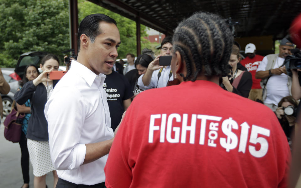 In this May 23, 2019, photo, Democratic presidential candidate and former U.S. Department of Housing and Urban Development Julian Castro speaks with a supporter before rallying with McDonald's employees and other activists in Durham, N.C. Hispanics are poised to help shape the 2020 Democratic primary in unprecedented ways. They comprise almost 30% of the population in the state that votes third in presidential primaries, Nevada. And the nation’s two largest Latino states, California and Texas, are among the 14 “Super Tuesday” states voting 10 just days later. (AP Photo/Gerry Broome)