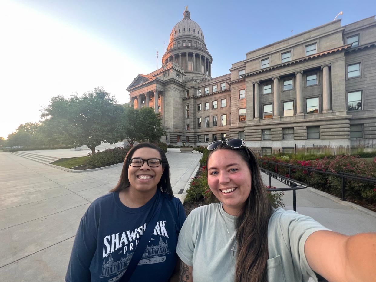 Tawney Beans and Alex take a selfie in front of the Idaho State Capitol Building.