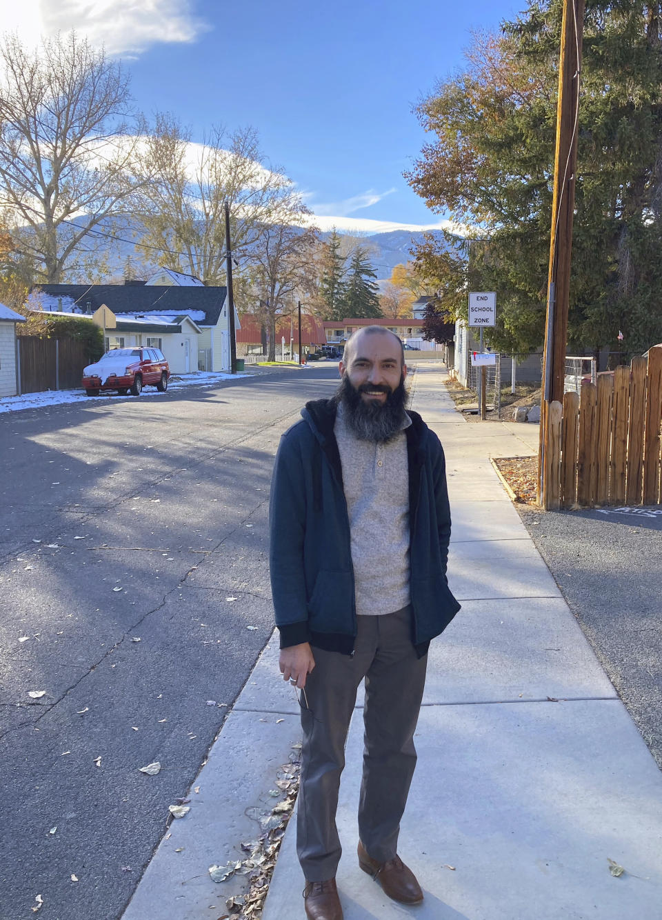 Daniel Echebarria, a 39-year-old supporter of President Donald Trump, poses for a picture in Carson City, Nev., where he works as a teacher. Echebarria lives in Sparks, Nev., and said he's disappointed and surprised in the results of the November election and isn't open to Joe Biden's message of unity after four years where he says Democrats prohibited the president from accomplishing his agenda by instead leaving him to fight the Russia investigation and impeachment. (AP Photo/Sam Metz)