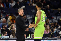 Minnesota Timberwolves head coach Chris Finch, left, talks with center Karl-Anthony Towns (32) in the second half of an NBA basketball game against the Memphis Grizzlies, Monday, Nov. 8, 2021, in Memphis, Tenn. (AP Photo/Brandon Dill)