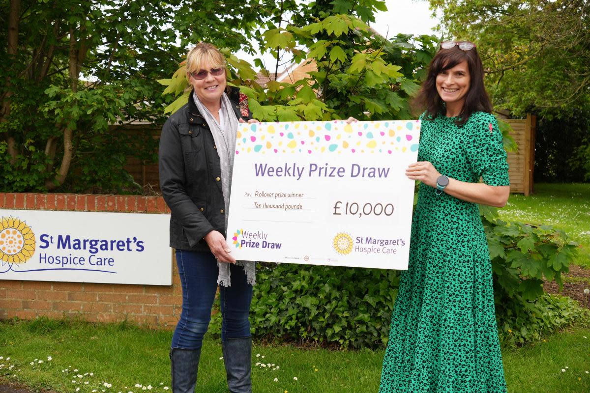 Winner Karen, left, receiving her prize from Joanna Hall <i>(Image: St Margaret's Hospice)</i>