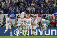 Croatia players celebrate their victory in the World Cup round of 16 soccer match between Japan and Croatia at the Al Janoub Stadium in Al Wakrah, Qatar, Monday, Dec. 5, 2022. (AP Photo/Eugene Hoshiko)