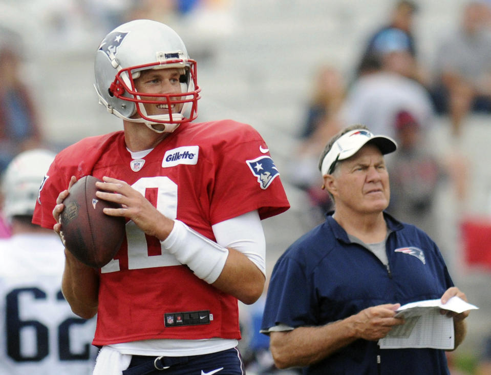 The relationship between Tom Brady and Bill Belichick is the subject of focus headed into wild-card weekend, even though the Patriots have a bye. (AP) 