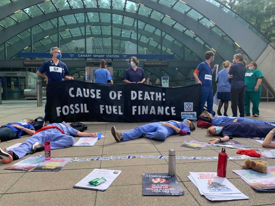 Doctors lay &#x002018;dead&#x002019; in front of Canary Wharf tube station (The Independent)