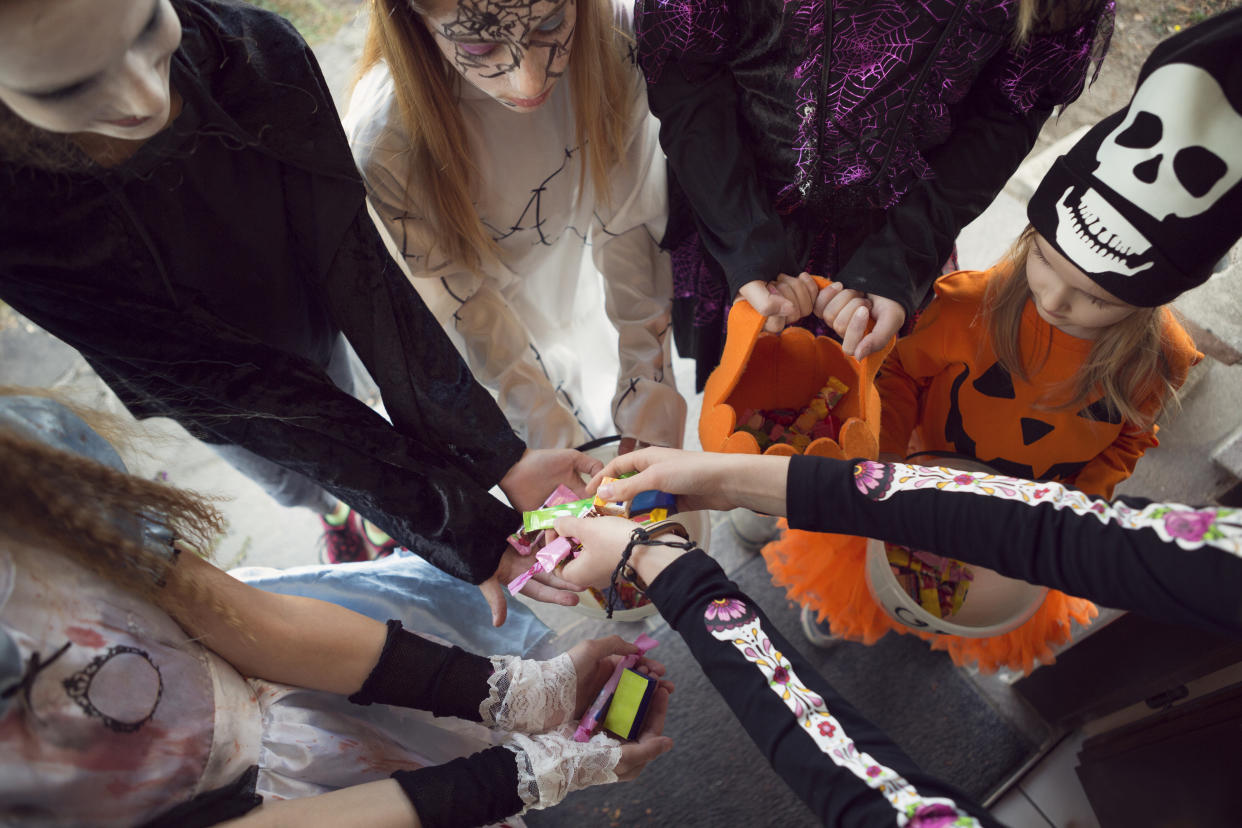 Whether you're the parent of a toddler or a teen, with some simple rules in place, there can be room for kids of all ages to trick-or-treat this Halloween. (Photo: Getty Creative)