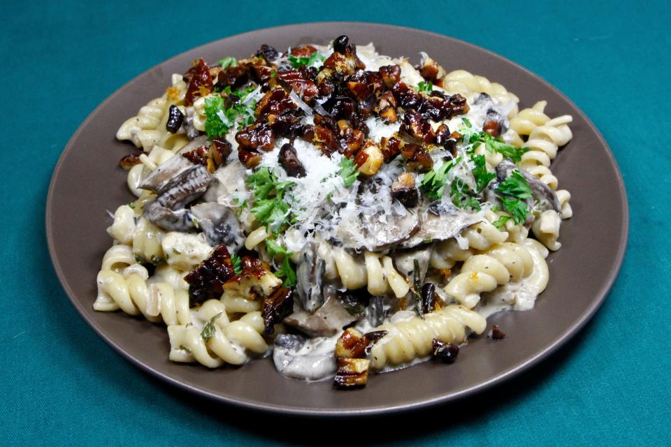 A mixture of mushrooms is featured in this Creamy Mushroom Pasta, while chopped pecans add a contrasting texture.